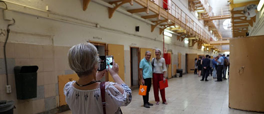 Visitors taking photos inside the old Model prison
